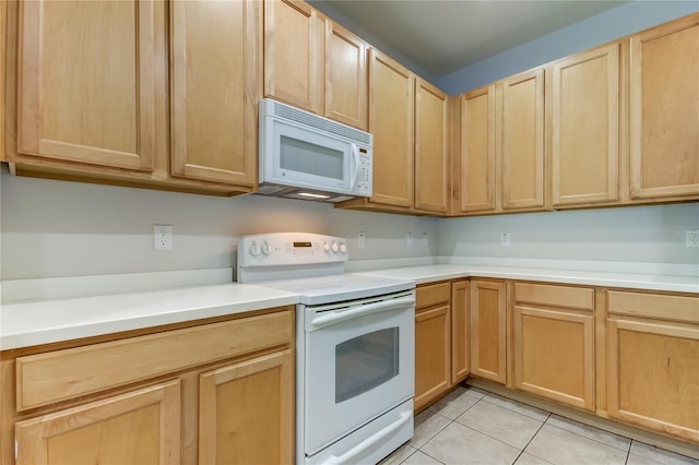 kitchen featuring light tile patterned flooring, white appliances, and light brown cabinetry