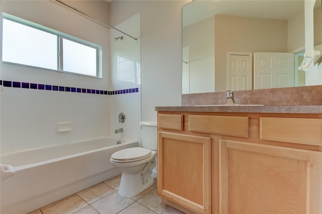 full bathroom with toilet, tiled shower / bath combo, vanity, and tile patterned floors