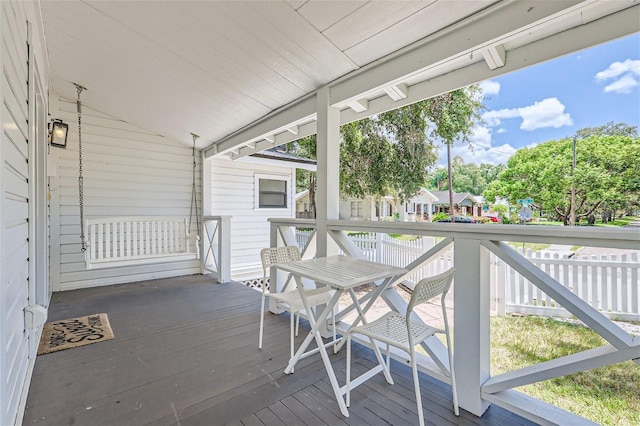 exterior space with vaulted ceiling and a wealth of natural light