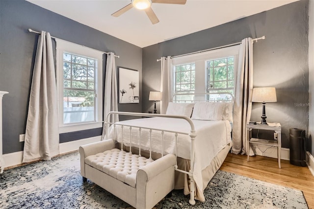 bedroom featuring ceiling fan and light hardwood / wood-style floors