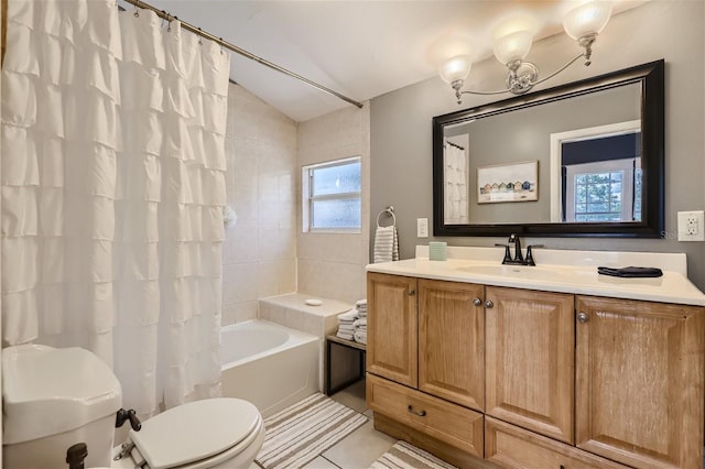 full bathroom featuring toilet, a notable chandelier, lofted ceiling, tile patterned flooring, and vanity