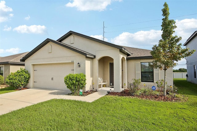 single story home featuring a front lawn and a garage