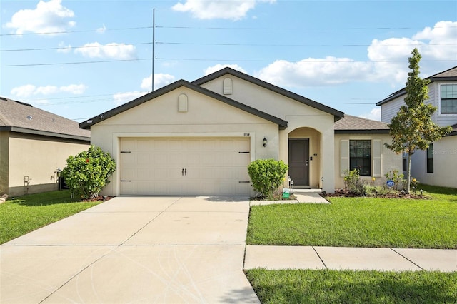 ranch-style house featuring a front yard and a garage