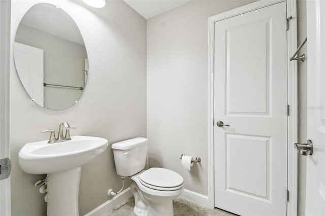 bathroom with tile patterned floors and toilet