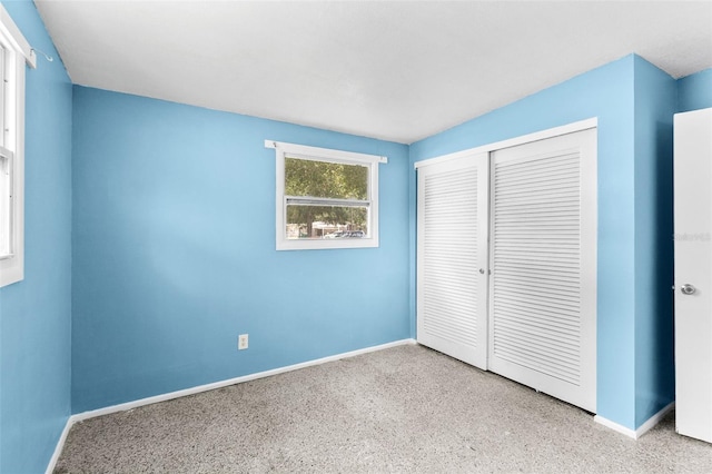 unfurnished bedroom with a closet