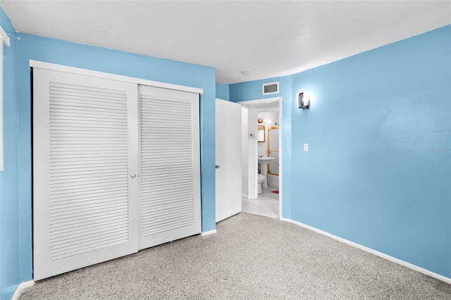 unfurnished bedroom with a closet