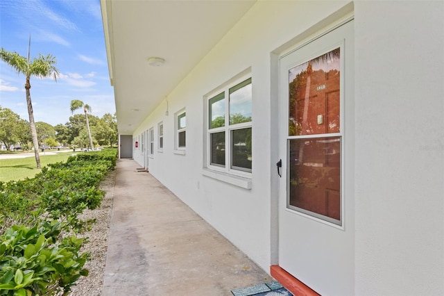 view of side of property featuring stucco siding