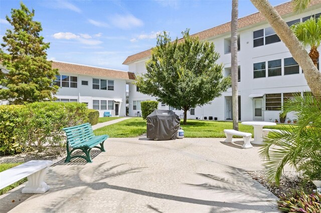 view of home's community featuring a lawn