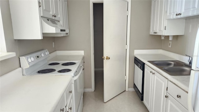 kitchen with white appliances, sink, and white cabinetry