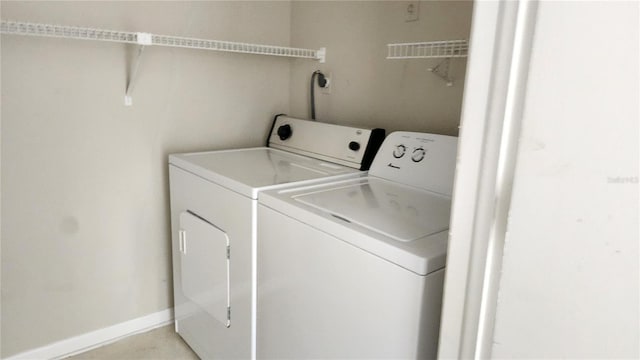 washroom with separate washer and dryer