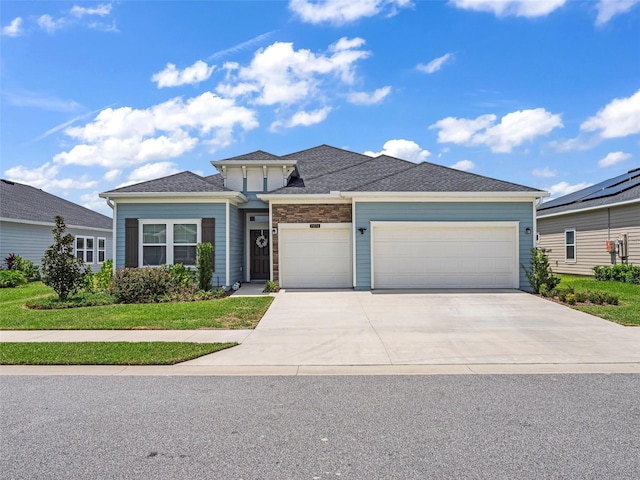 view of front of house featuring a garage and concrete driveway