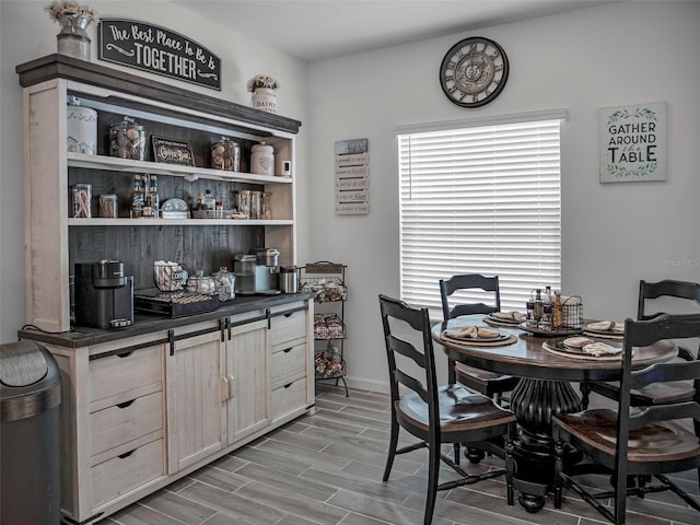 dining room with wood tiled floor