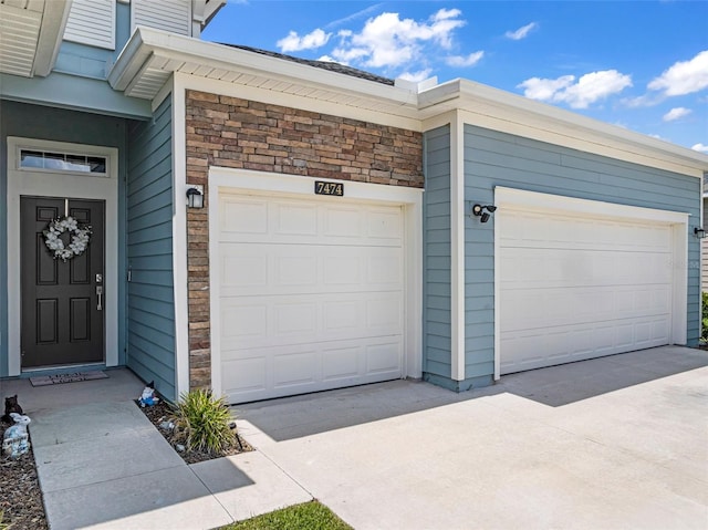 garage featuring driveway