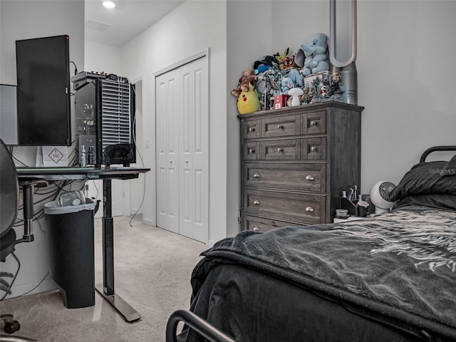 bedroom featuring carpet floors, a closet, and visible vents