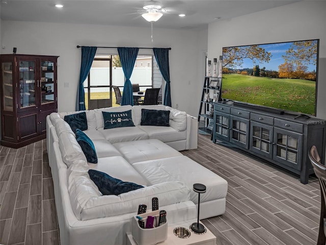 living room featuring wood finish floors, ceiling fan, and recessed lighting