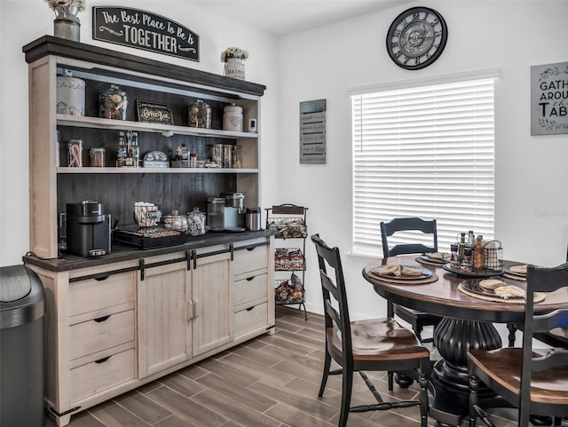 dining area with wood finish floors