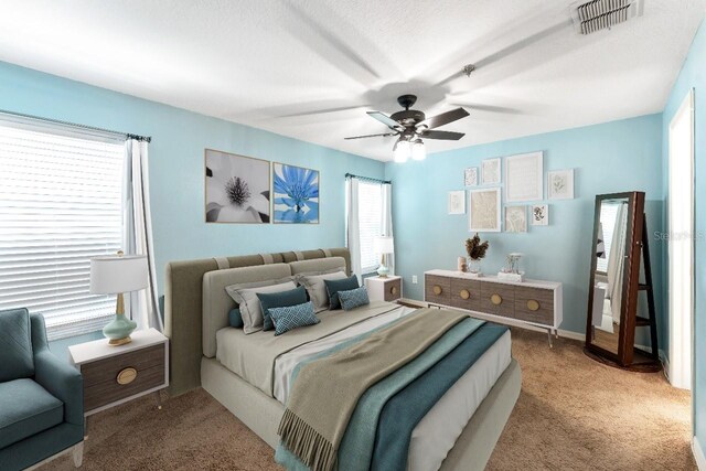 bedroom featuring ceiling fan and carpet flooring