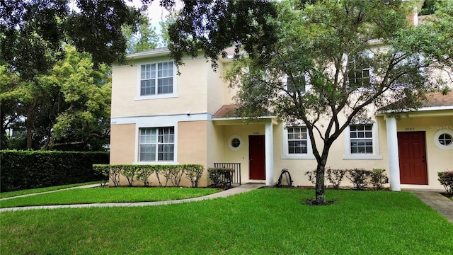 view of front of property with a front lawn