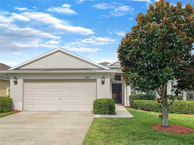 single story home featuring a garage and a front yard