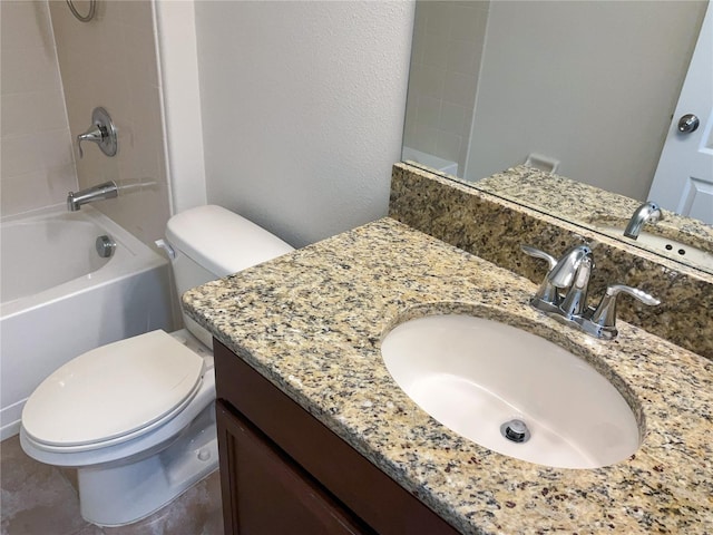 bathroom with vanity, toilet, and shower / bathtub combination