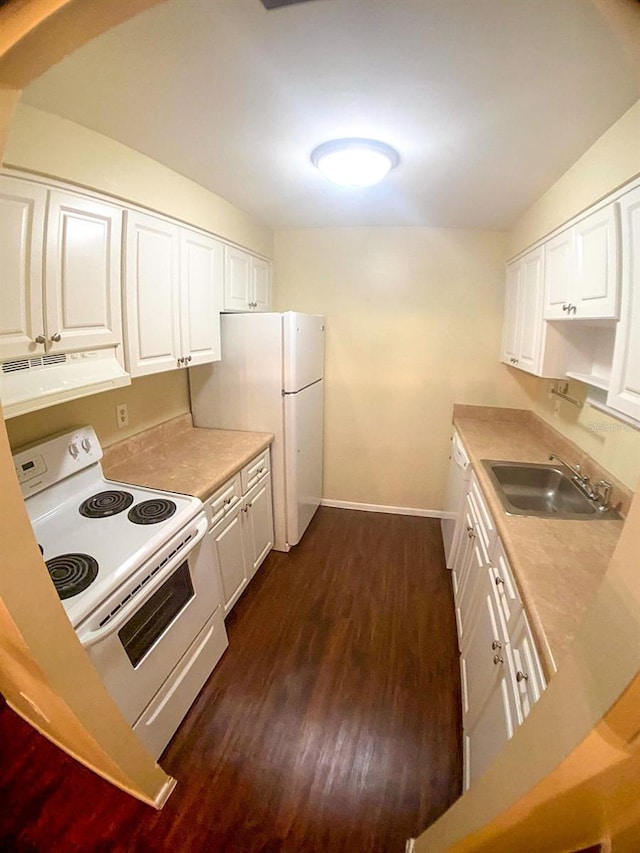 kitchen featuring dark wood-type flooring, white cabinets, white appliances, and sink