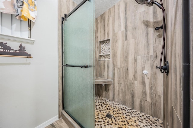 bathroom with a shower with shower door