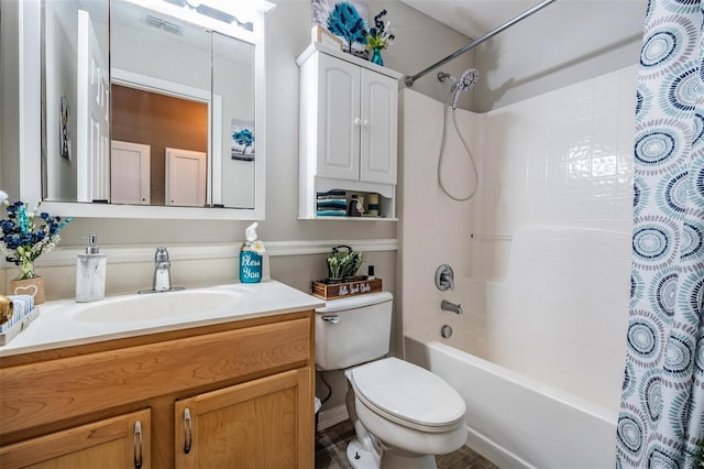 full bathroom with shower / bath combination with curtain, vanity, and toilet