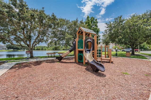 view of jungle gym with a water view