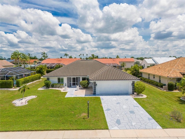 mediterranean / spanish home with a lanai and a front yard