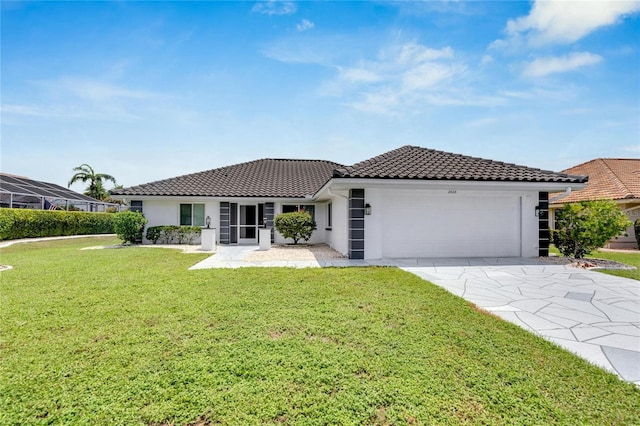 view of front facade featuring a front lawn and a garage