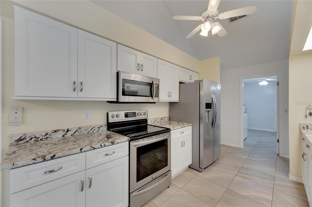 kitchen with ceiling fan, white cabinets, light tile patterned floors, and stainless steel appliances