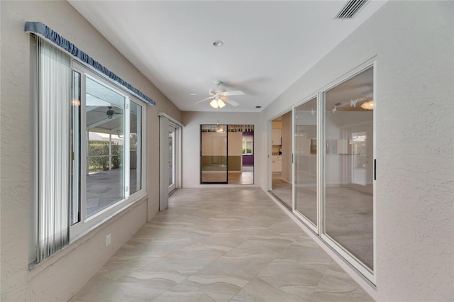 hall with light tile patterned flooring