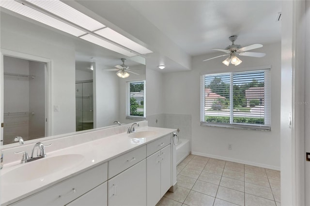 bathroom featuring ceiling fan, dual vanity, and tile patterned floors