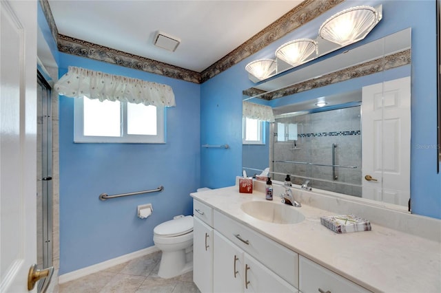 bathroom featuring toilet, vanity, and tile patterned floors