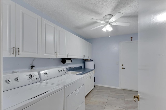 laundry area featuring ceiling fan, cabinets, independent washer and dryer, sink, and light tile patterned flooring