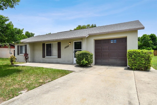 ranch-style house featuring a garage