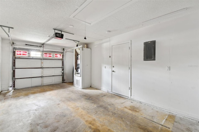 garage with a garage door opener and electric panel