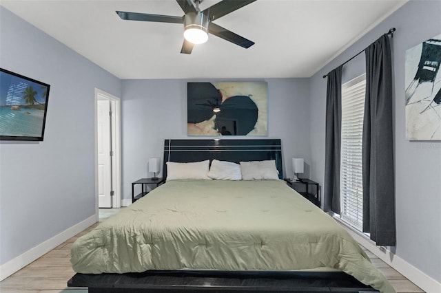 bedroom featuring ceiling fan and light hardwood / wood-style floors