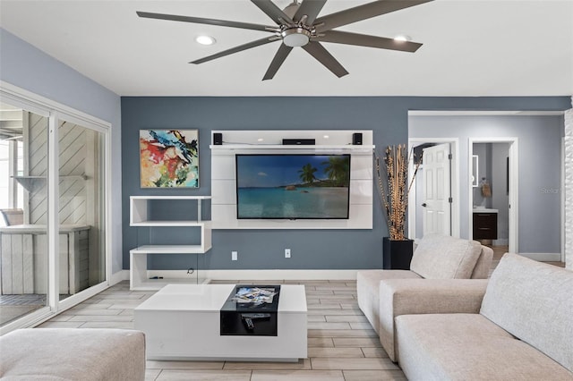 living room featuring light hardwood / wood-style floors and ceiling fan