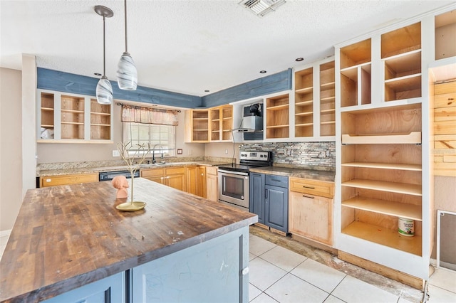 kitchen with wooden counters, sink, light tile patterned floors, stainless steel electric range oven, and hanging light fixtures