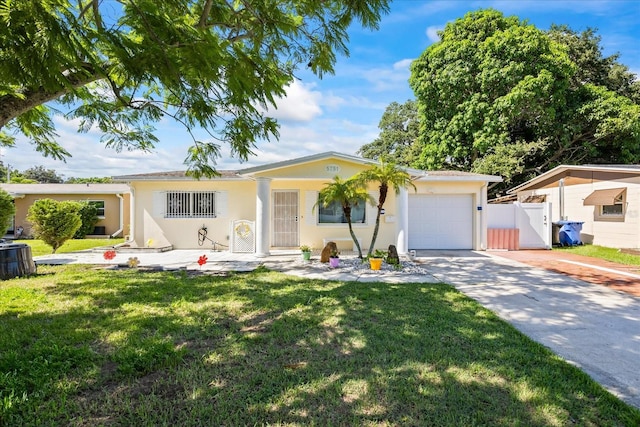 single story home featuring a garage, cooling unit, and a front yard