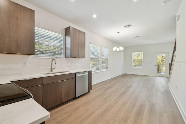 kitchen featuring a sink, light wood-type flooring, light countertops, and dishwasher