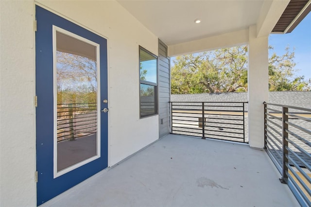 view of patio featuring a balcony