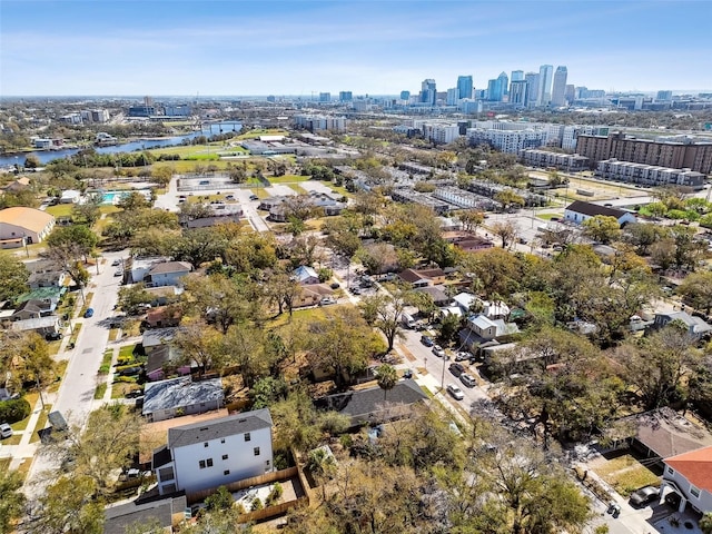 birds eye view of property featuring a water view and a city view