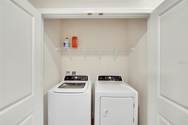 laundry room with independent washer and dryer