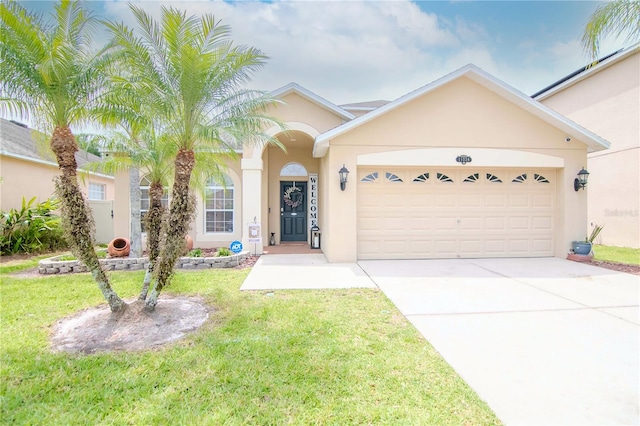 ranch-style house featuring a front lawn and a garage