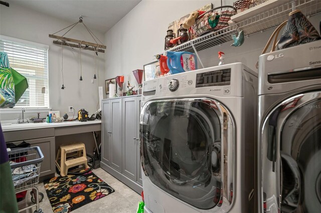 laundry room featuring separate washer and dryer and sink