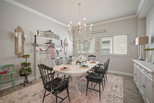 dining area featuring light hardwood / wood-style flooring, an inviting chandelier, and ornamental molding