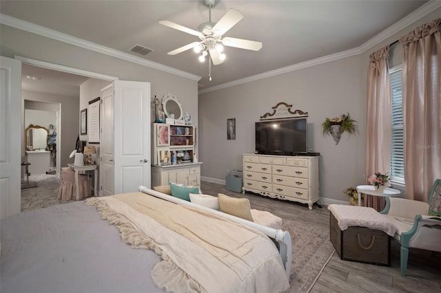 bedroom with multiple windows, hardwood / wood-style floors, ceiling fan, and ornamental molding