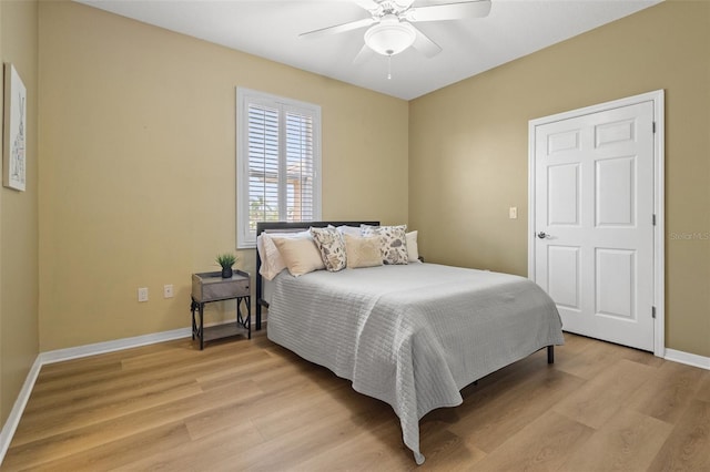 bedroom with ceiling fan and light hardwood / wood-style flooring